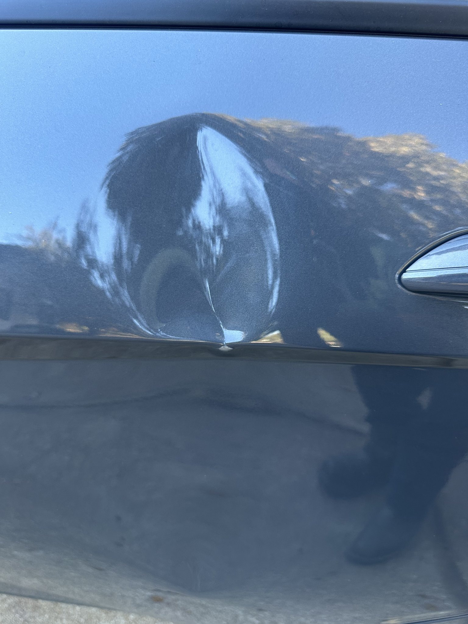 Hyundai Elantra door dent before repair